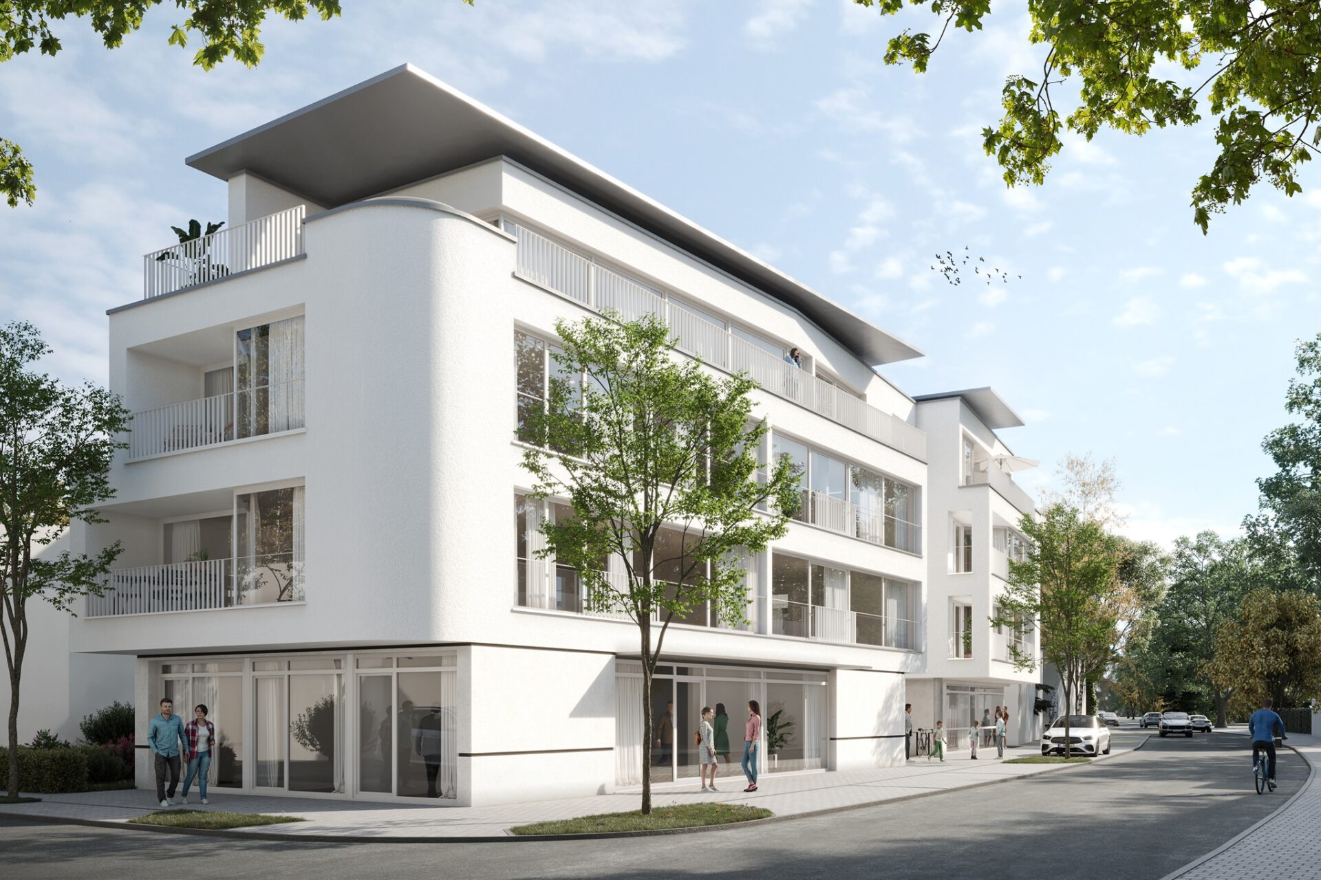 Moderne weiße Wohnanlage mit Balkonen und Grünflächen in urbaner Umgebung.