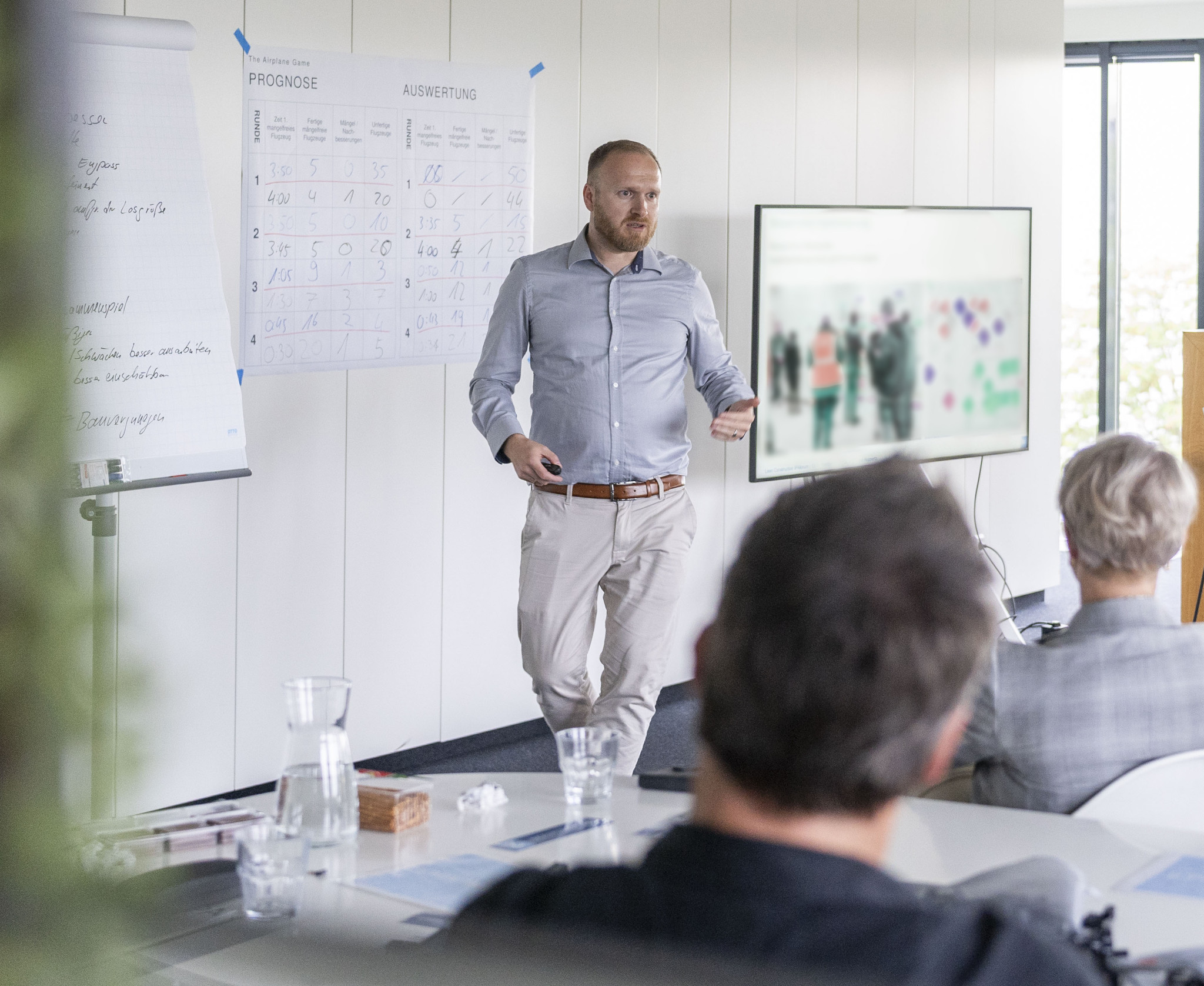 Participants in an in-house training course learn lean construction methods for construction projects in the lean expert training course.